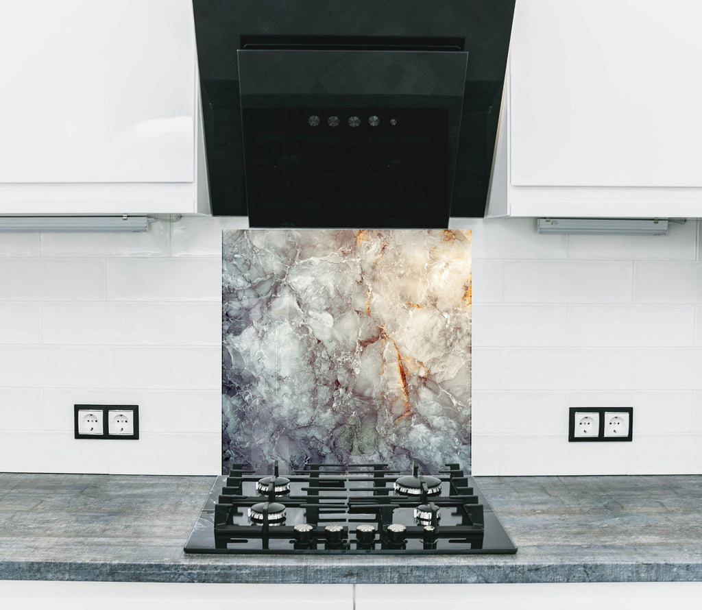 Elegant kitchen backsplash featuring natural marble texture with golden veining, perfect for refined interiors.

