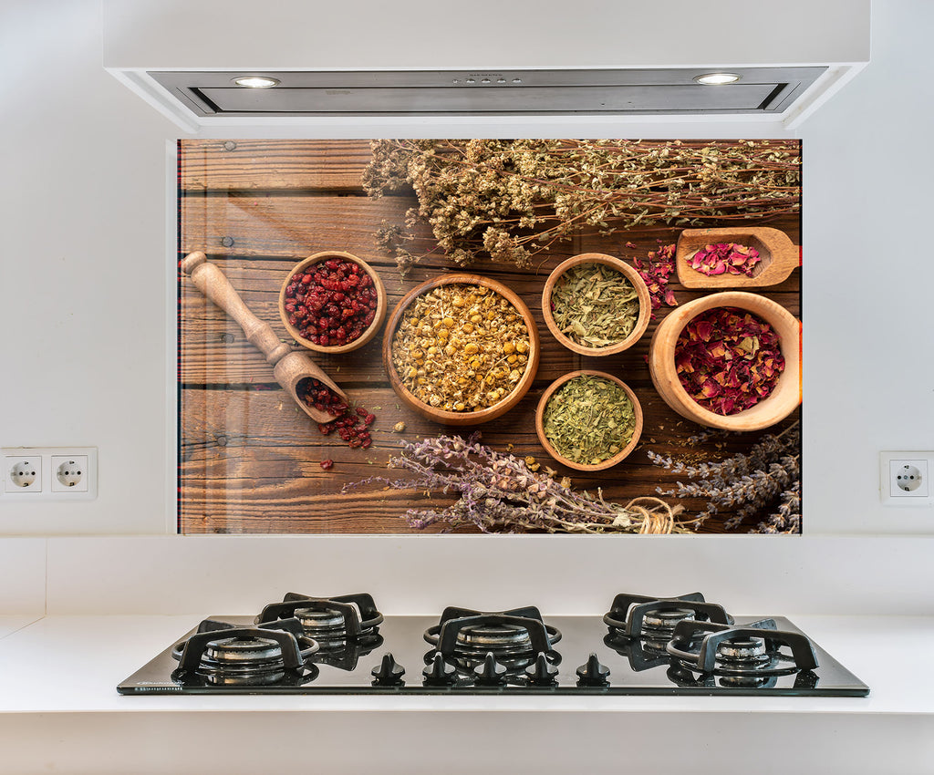 a picture of spices on a wall above a stove