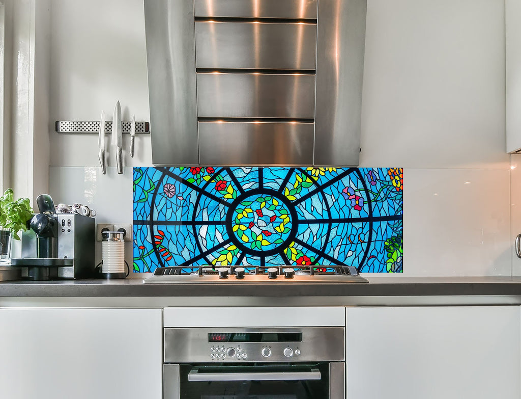 a kitchen with a stove top oven and a stained glass window