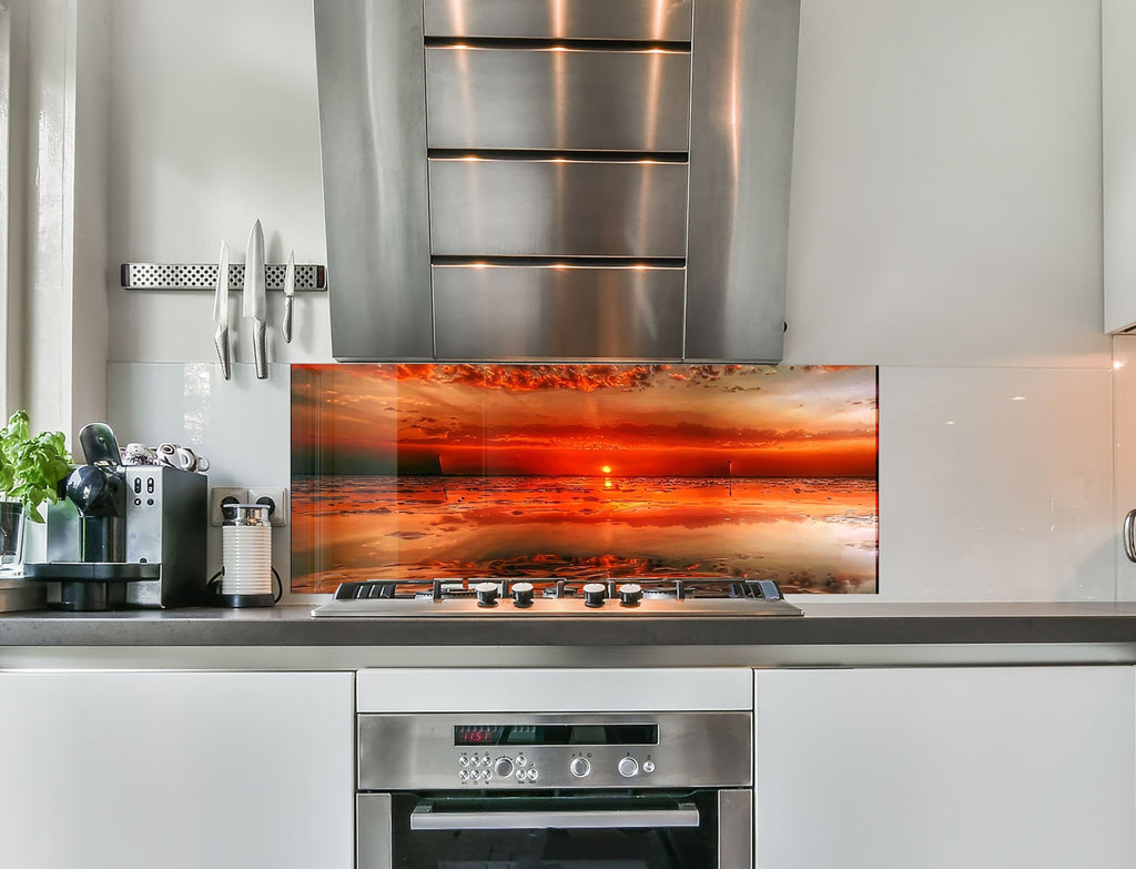 a kitchen with a stainless steel stove top oven